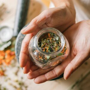 A Person Holding a Glass Jar