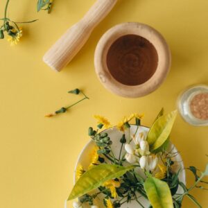 White and Yellow Flowers on Brown Wooden Vase